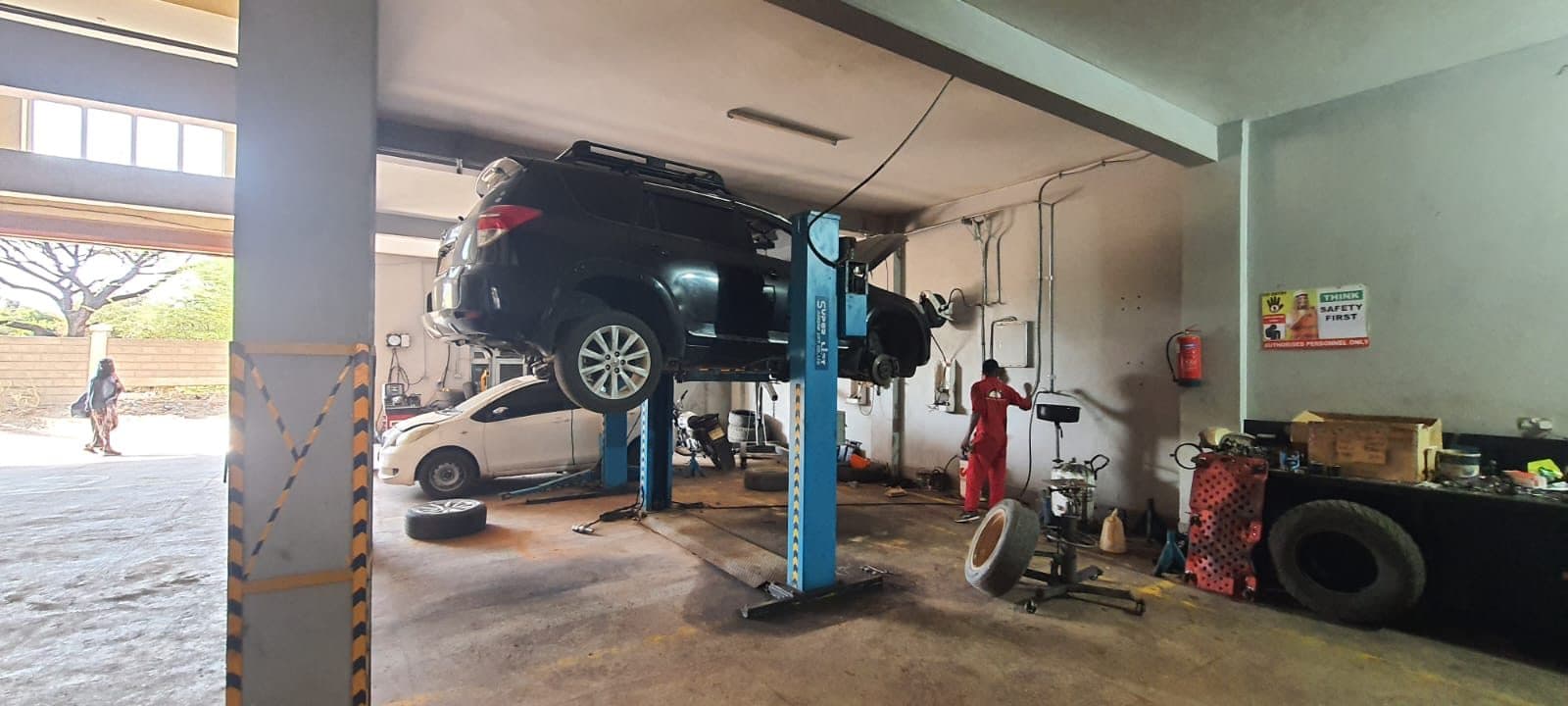 Mechanics at Parkside Garage Isiolo servicing a vehicle on a lift
